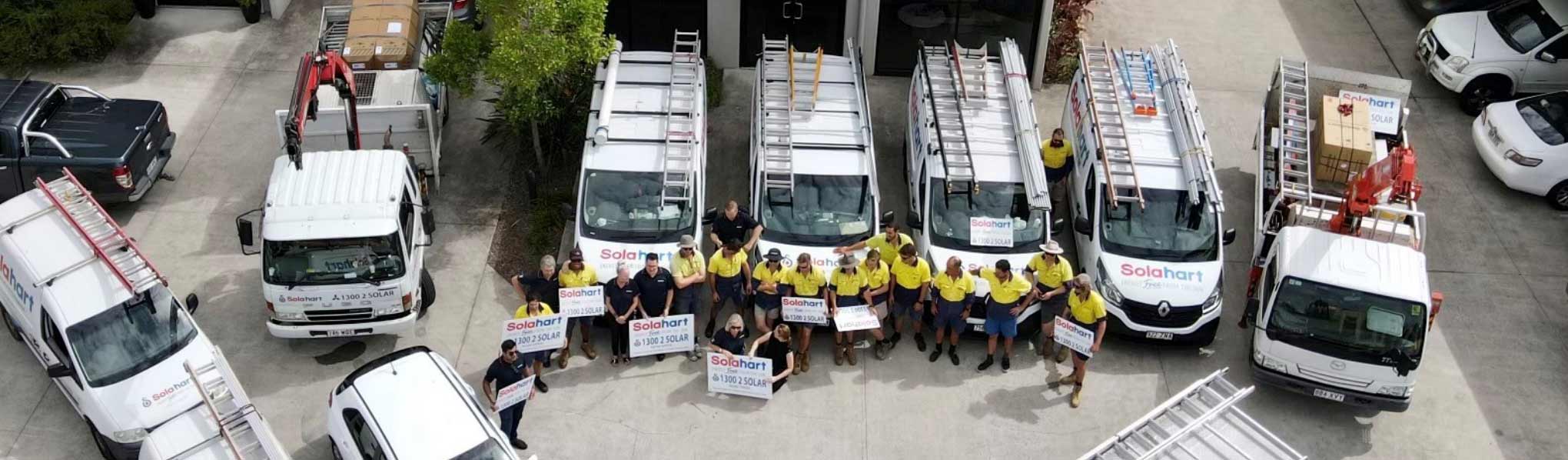 Solahart Sunshine Coast team and vehicles out the front of their offices at Coolum, Queensland