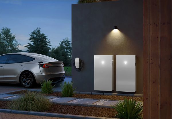 Tesla Powerwall 3 Battery installed on outside of house with Tesla Wall Connector and Tesla Model 3 car nearby